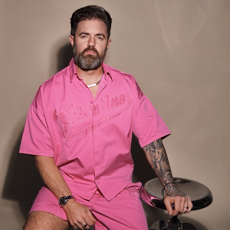 Russ Perry, RU$$ DOLLA $IGN, in a pink suit